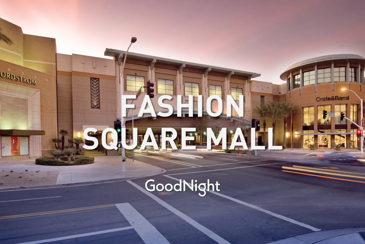 A vibrant city street scene with the Nordstrom and Crate & Barrel storefronts, traffic signals, palm trees, and bustling sidewalks. The lively setting speaks to accessibility, shopping, dining, and ease of movement in a walkable, dynamic neighborhood.