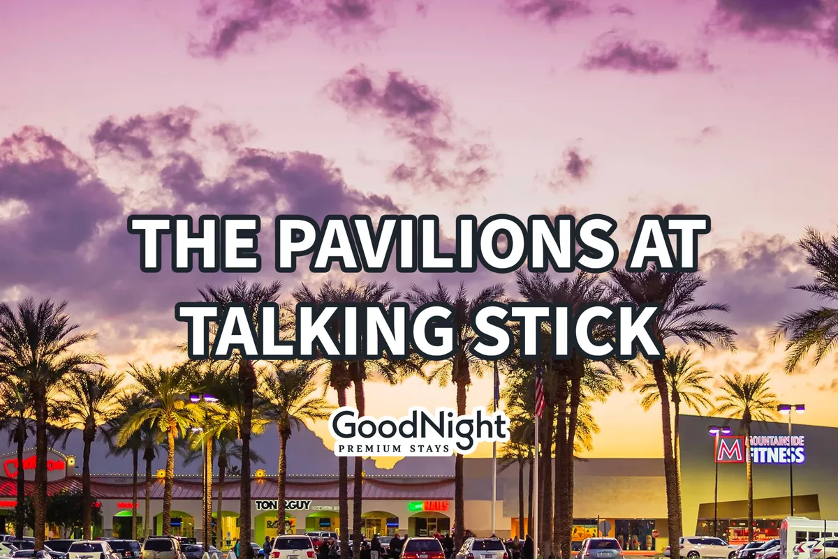 A lively Old Town Scottsdale streetscape at sunset, lined with swaying palm trees and colorful storefronts. The inviting atmosphere hints at pet-friendly patios, shops, and an easygoing neighborhood vibe, all within a short walk or drive from the condo.